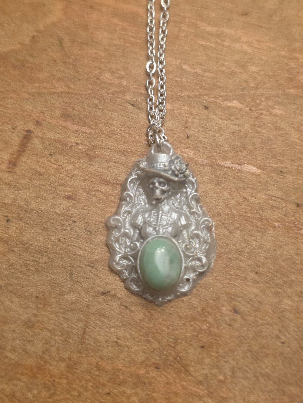 White Skull Lady With Green Gemstone Center Pendant On Silver Tone Necklace